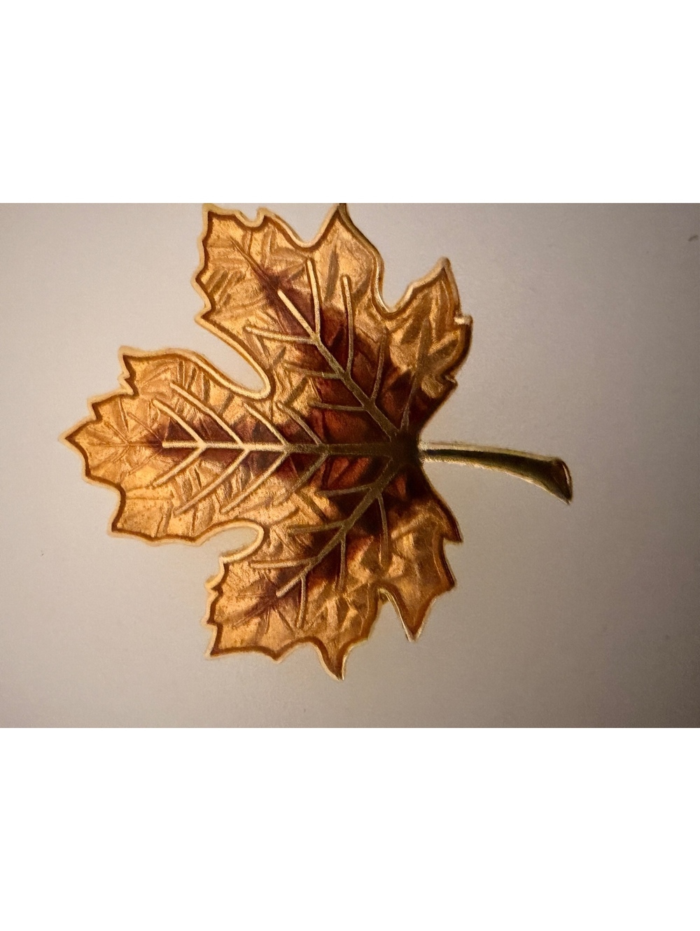 Gold tone maple leaf brooch